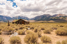abandoned cabin in a desert landscape 