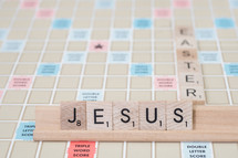 scrabble pieces forming the words Jesus and Easter