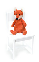 stuffed animal in a chair 