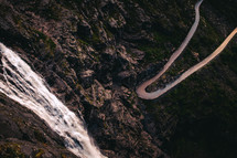winding mountain road and waterfall 