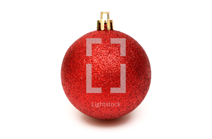 red glittery ornament on a white background 