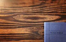 Background with a Bible on a Rustic Wooden Table