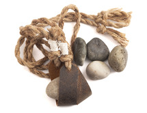 A Sling Shot and Stones Isolated on a White Background from the Story of David and Goliath in the BIble 