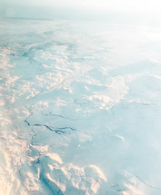 aerial view over a frozen landscape 