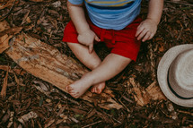 toddler boy with dirty feet 