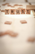 word Trust from scrabble pieces 