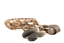 A Sling Shot and Stones Isolated on a White Background from the Story of David and Goliath in the BIble 