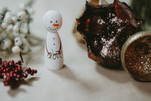snowman figurine with word love 
