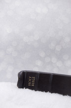 Holy Bible on snow 