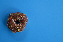 sprinkled donut on a blue background 