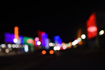 bokeh lights on a city street at night 