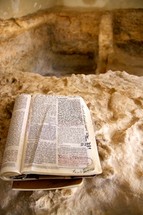 Bible opened next to the Empty Tomb