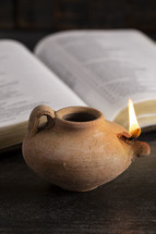 oil lamp and opened Bible 