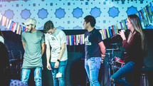 young people on stage answering questions during a worship service 