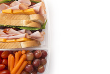 Healthy Packed Lunch of Ham Sandwich and Veggies
