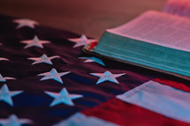 American flag next to a bible