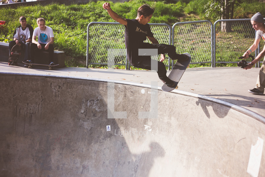 a man doing tricks on a skateboard in a skatepark 