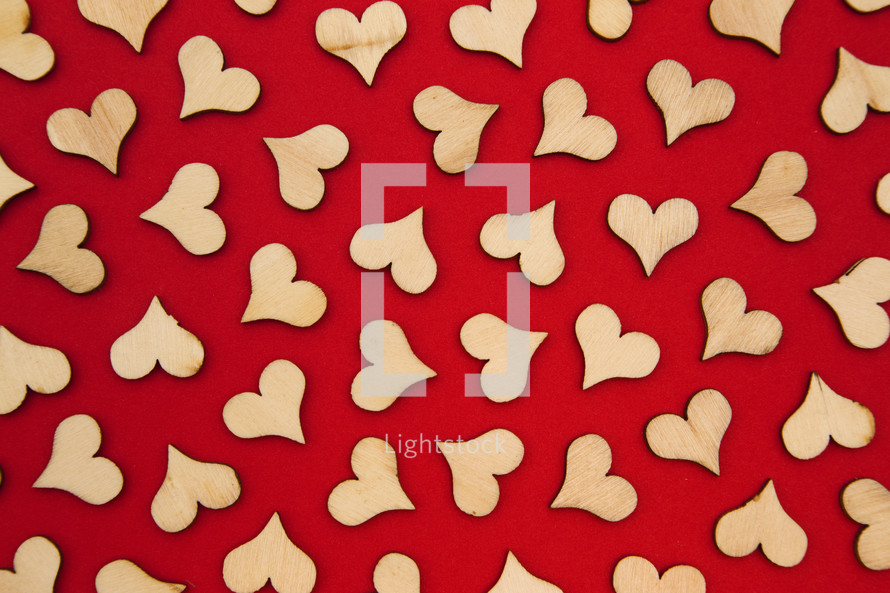 wood cutout hearts on red 