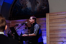 man singing during a worship service 