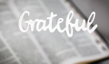 word grateful over an open Bible 