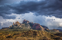 clouds over red rock peaks 