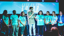 young people on stage during a worship service 