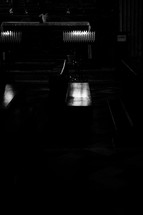 bench in a dark cathedral 