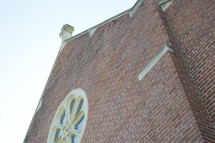 side of a brick church building 