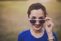 woman wearing stars and stripes sunglasses 