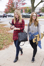friends walking to class on campus 
