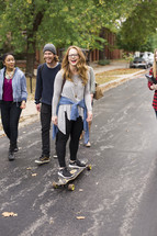 young adults walking on a street 