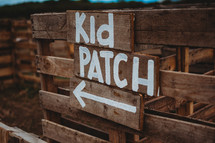 Kid patch sign at a pumpkin patch 