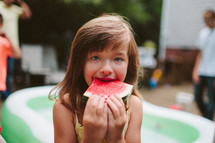 girl child eating a watermelon