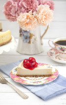 cheese cake slice with cherry topping 