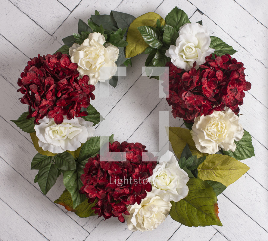 white and red flower wreath 