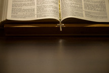 cross necklace bookmark in a Bible 