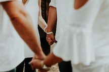 couple's holding hands in prayer 