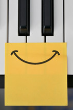 piano keys and smiley face 