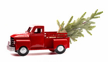 red truck with a Christmas tree 