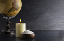 globe, candle, and bowl of salt 