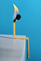 person's head on a flaming match