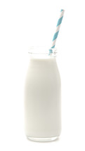 a straw in a glass bottle of milk 