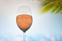 Glass Of Rose Champagne Sparkling Wine in Summer