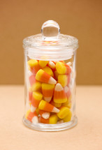 candy corn in a glass jar 