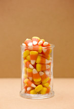 candy corn in a glass jar 