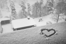 Hand drawn heart in the frozen snow