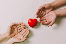 red heart and cupped hands 