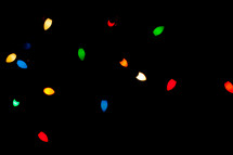 glowing Christmas lights in darkness 