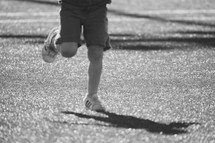 a child running on astroturf 