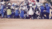 Lacrosse team in a huddle 